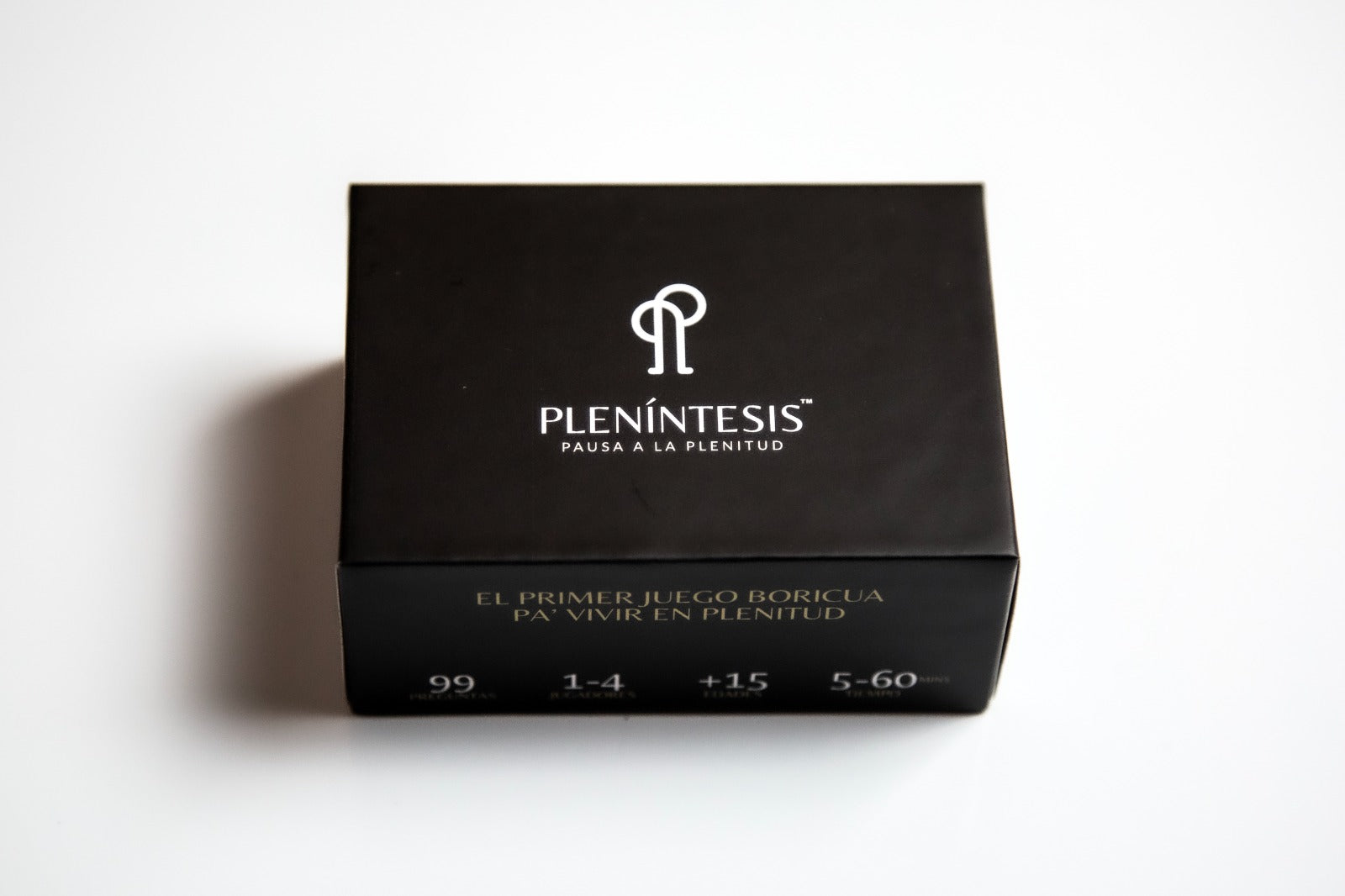 Black box with Plenintesis branding on a white background