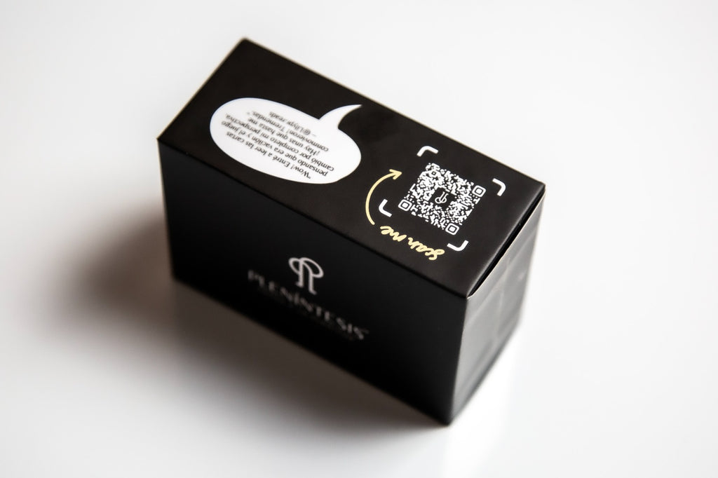 Plenintesis Black box with speech bubble and QR code design on a white background