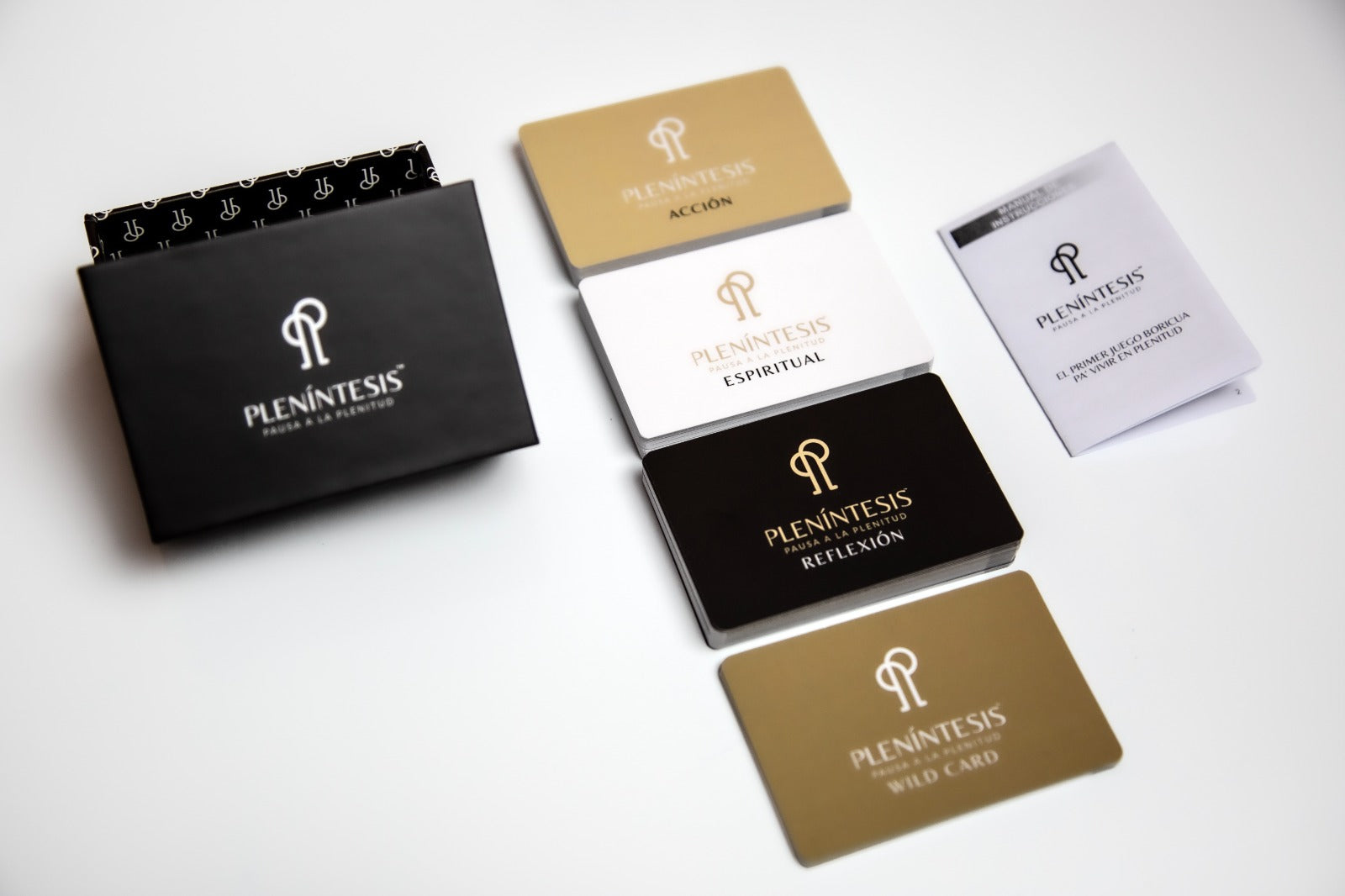 Collection of Plenintesis branded cards and packaging on a white background