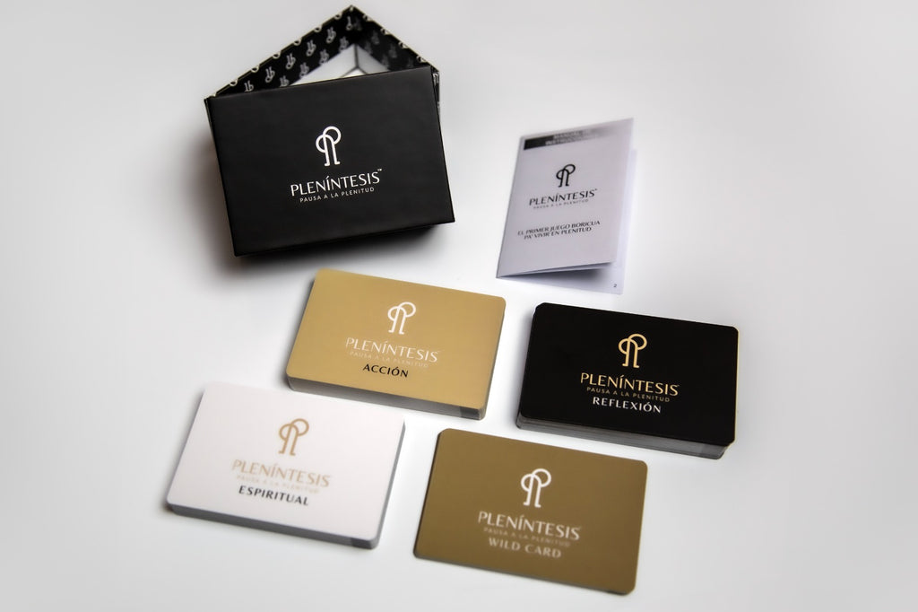 Collection of Plenintesis branded cards and a black box on a light gray background